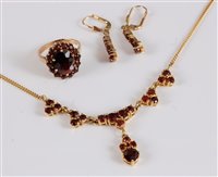 Lot 2580 - A 9ct garnet suite, comprising of a necklace,...
