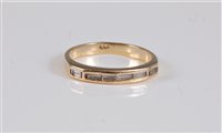 Lot 2649 - An 18ct diamond half hoop ring, with channel...