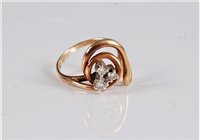Lot 2644 - A three stone diamond ring, the three round...