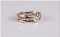 Lot 2662 - An 18k diamond half hoop ring, the three...