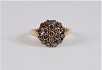 Lot 2621 - A 9ct diamond cluster ring, the chocolate...