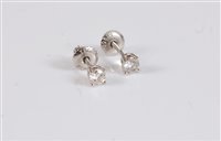 Lot 2617 - A pair of platinum Tiffany diamond earstuds,...