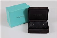 Lot 2615 - A pair of platinum Tiffany diamond ear studs,...
