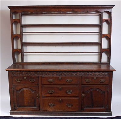 Lot 1110 - A George III oak dresser base having...