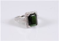 Lot 1292 - A 14k green tourmaline and diamond ring, the...