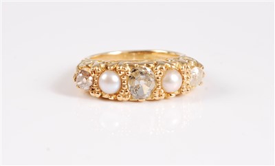 Lot 2575 - An 18ct gold diamond and split pearl ring, the...