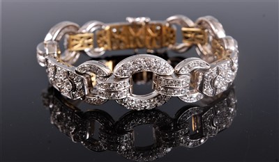 Lot 1246 - An Art Deco diamond bracelet, with a repeating...