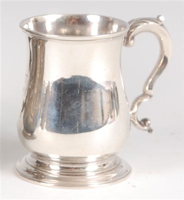 Lot 1205 - A George II silver tankard, of bell shape,...
