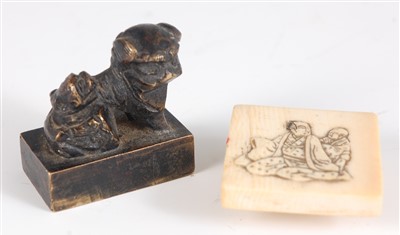 Lot 1418 - A small Chinese bronze seal, modelled as a foo...