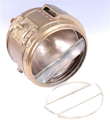 Lot 239 - An early 20th century brass cased ships search light