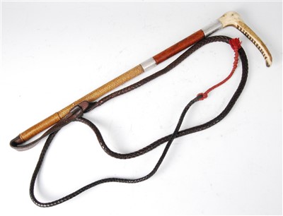 Lot 338 - An early 20th century plaited leather clad riding crop