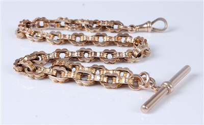 Lot 1315 - A 9ct gold fancylink watch chain with Albert,...