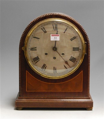 Lot 14 - A 1920s mahogany cased dome-top mantel clock,...