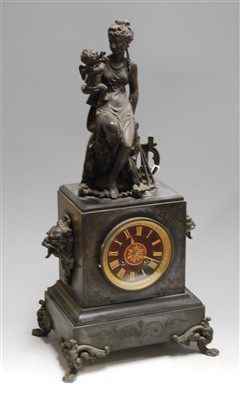 Lot 112 - A late 19th century black slate cased mantel...