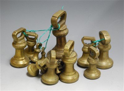 Lot 127 - A collection of miscellaneous brass weights,...
