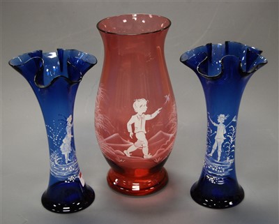 Lot 150 - A pair of Victorian Mary Gregory blue glass...
