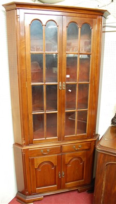 Lot 1104 - A contemporary mahogany freestanding corner...