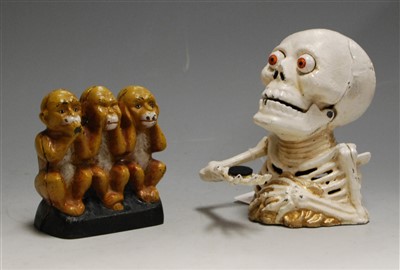 Lot 189 - A reproduction cast iron novelty money box in...