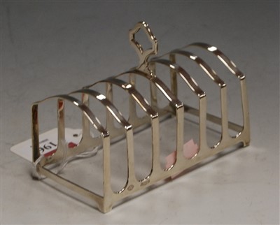 Lot 196 - A modern silver six division toast rack by...