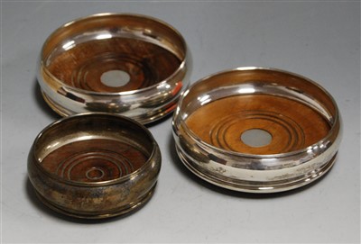 Lot 204 - A pair of modern silver bottle coasters in the...