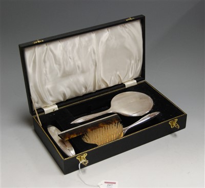 Lot 207 - An Art Deco style silver mounted four piece...