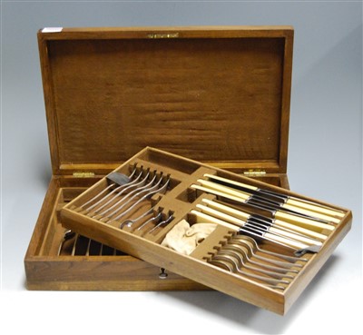 Lot 219 - A mid-20th century oak cased canteen of silver...