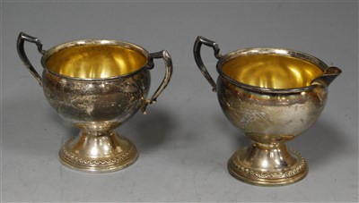 Lot 229 - An early 20th century sterling silver cream...