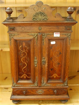 Lot 1179 - An early 20th century oak, rosewood and...