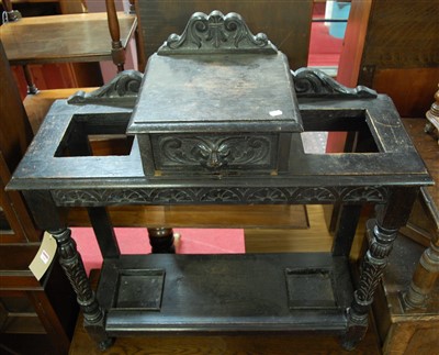 Lot 1247 - A circa 1900 ebonised and heavily carved oak...