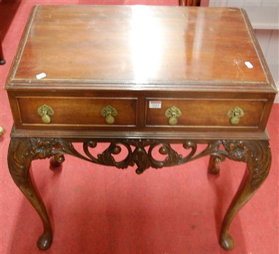Lot 1213 - A walnut two drawer side table, in the...