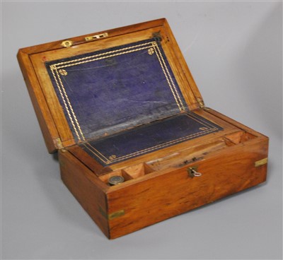 Lot 257 - A Victorian walnut and brass bound writing...