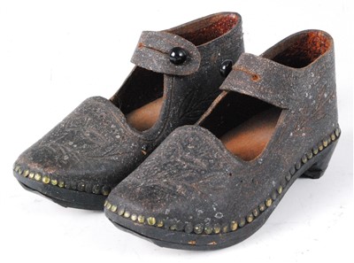 Lot 643 - A pair of child's engraved and brass studded leather tap shoes