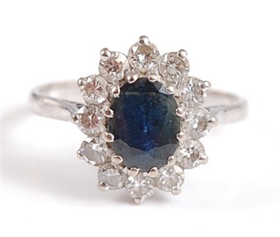 Lot 2501 - A 9ct white gold and sapphire oval cluster...
