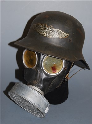 Lot 252 - A German Luftschutz steel helmet, with logo;...