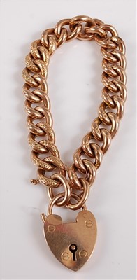 Lot 2543 - A 9ct gold hollow curblink bracelet, with...