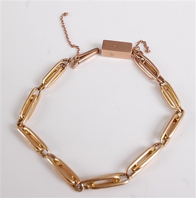 Lot 2545 - A yellow metal watch chain, comprising eight...