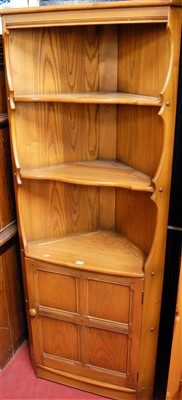 Lot 1098 - A contemporary Ercol mid elm freestanding...
