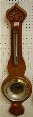Lot 1119 - An early 20th century floral carved oak two...