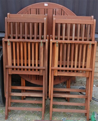 Lot 1123 - A modern stained and slatted teak circular...