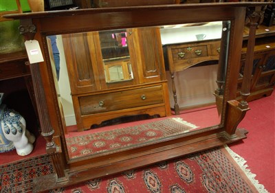 Lot 1147 - An Edwardian walnut bevelled overmantel mirror,...