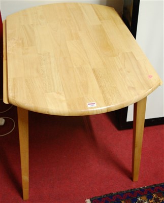 Lot 1152 - A modern rubber-wood dropflap breakfast table