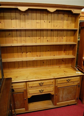 Lot 1162 - A modern pine kitchen dresser, having...