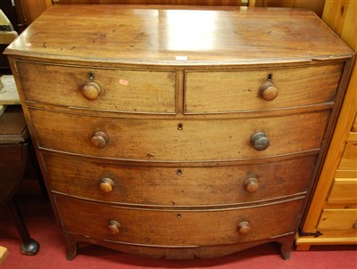 Lot 1178 - A 19th century mahogany bowfront chest, of two...