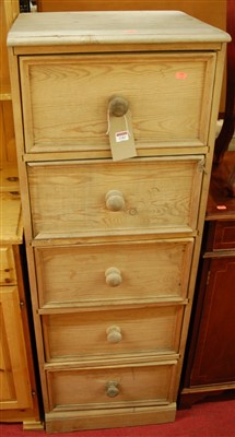 Lot 1183 - A modern pine narrow chest, of five drawers, w....