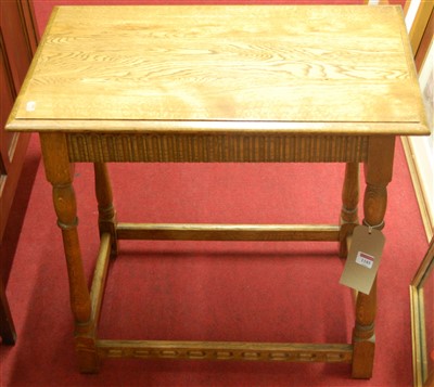Lot 1185 - A light oak rectangular side table, having an...
