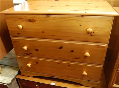Lot 1193 - A modern pine low chest, of three long drawers,...