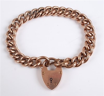 Lot 2574 - A 9ct gold hollow curblink bracelet, with...