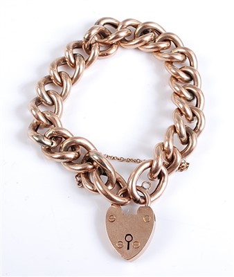 Lot 2576 - A 9ct gold hollow curblink bracelet, with...