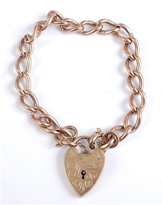 Lot 2577 - A 9ct gold curblink bracelet, with heart...
