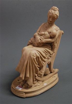 Lot 11 - A reproduction earthenware figure of a mother...